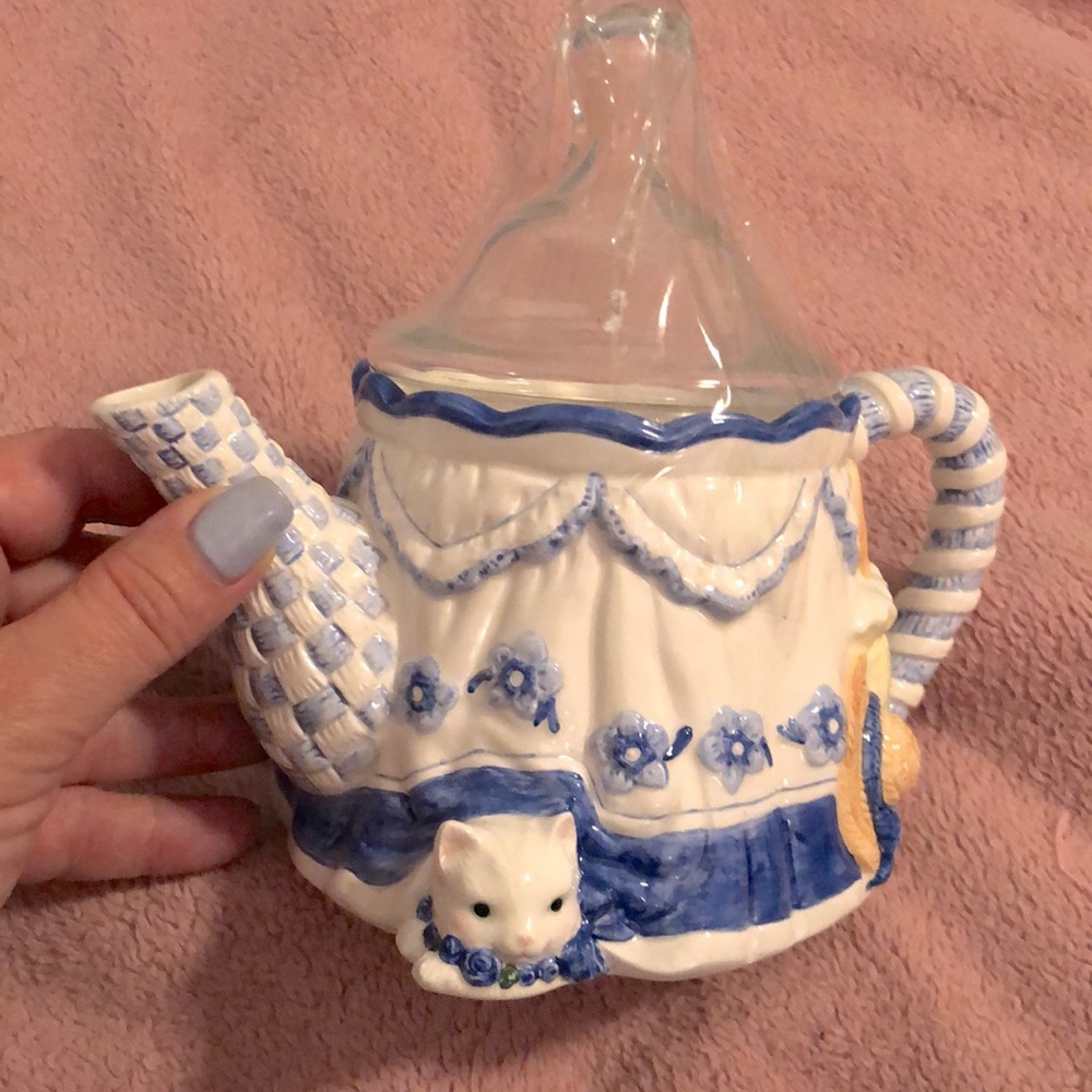 Cutest teapot with kitty cat on bottom. Blue and white mainly. Excellent shape